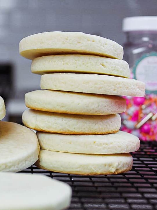 image of cream cheese sugar cookies stacked and baked