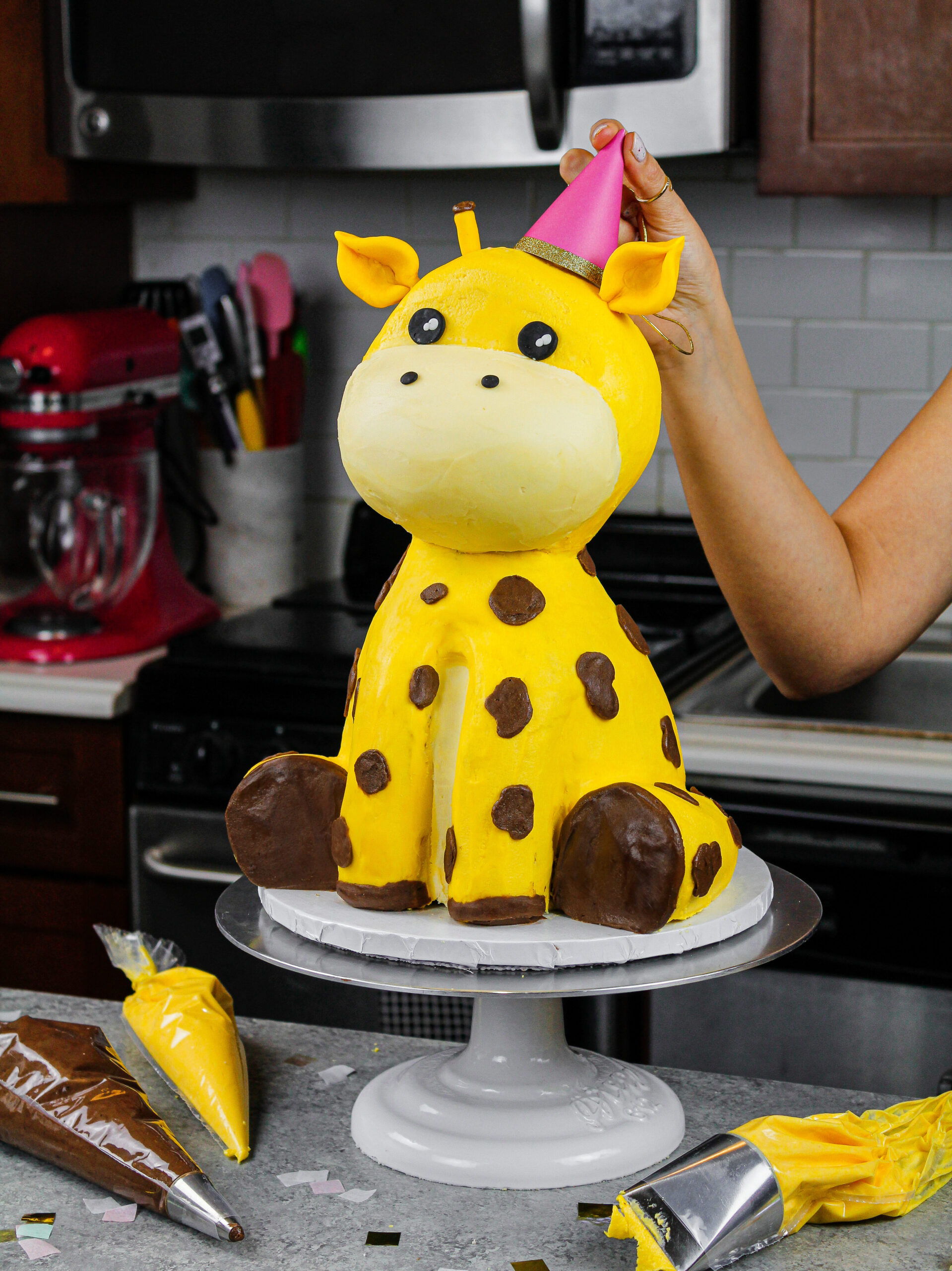 image of a giraffe cake made with buttercream and rice krispies