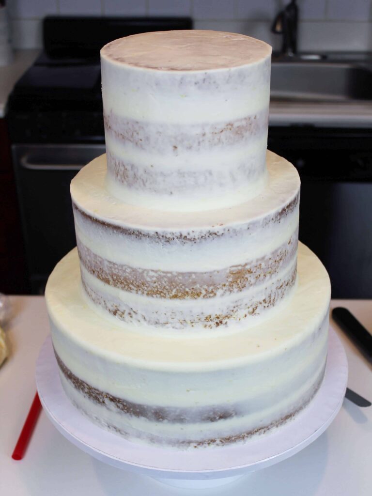 assembled semi-naked tiered wedding cake