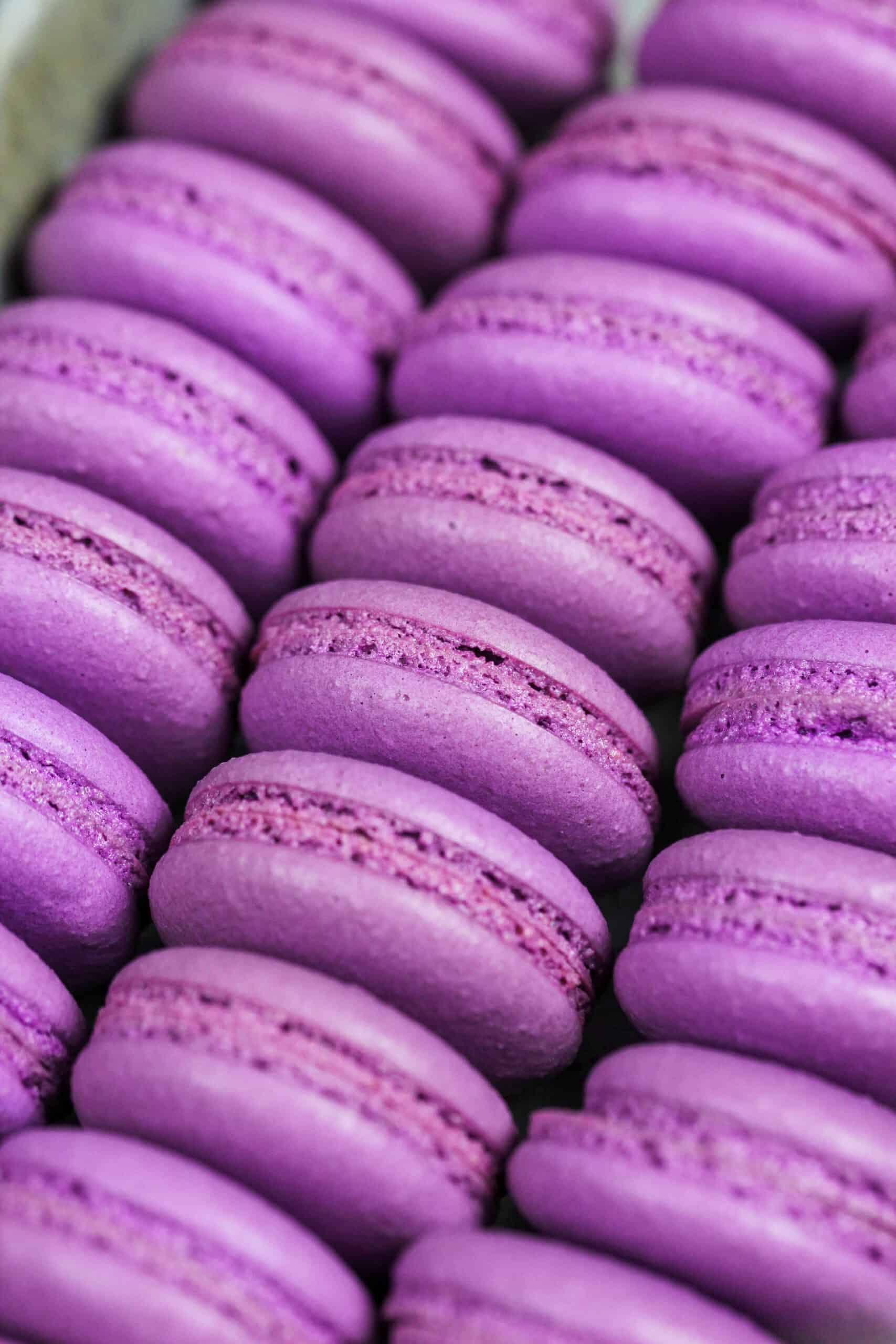 image of purple french macaron shells baked with perfect feet ready to be filled