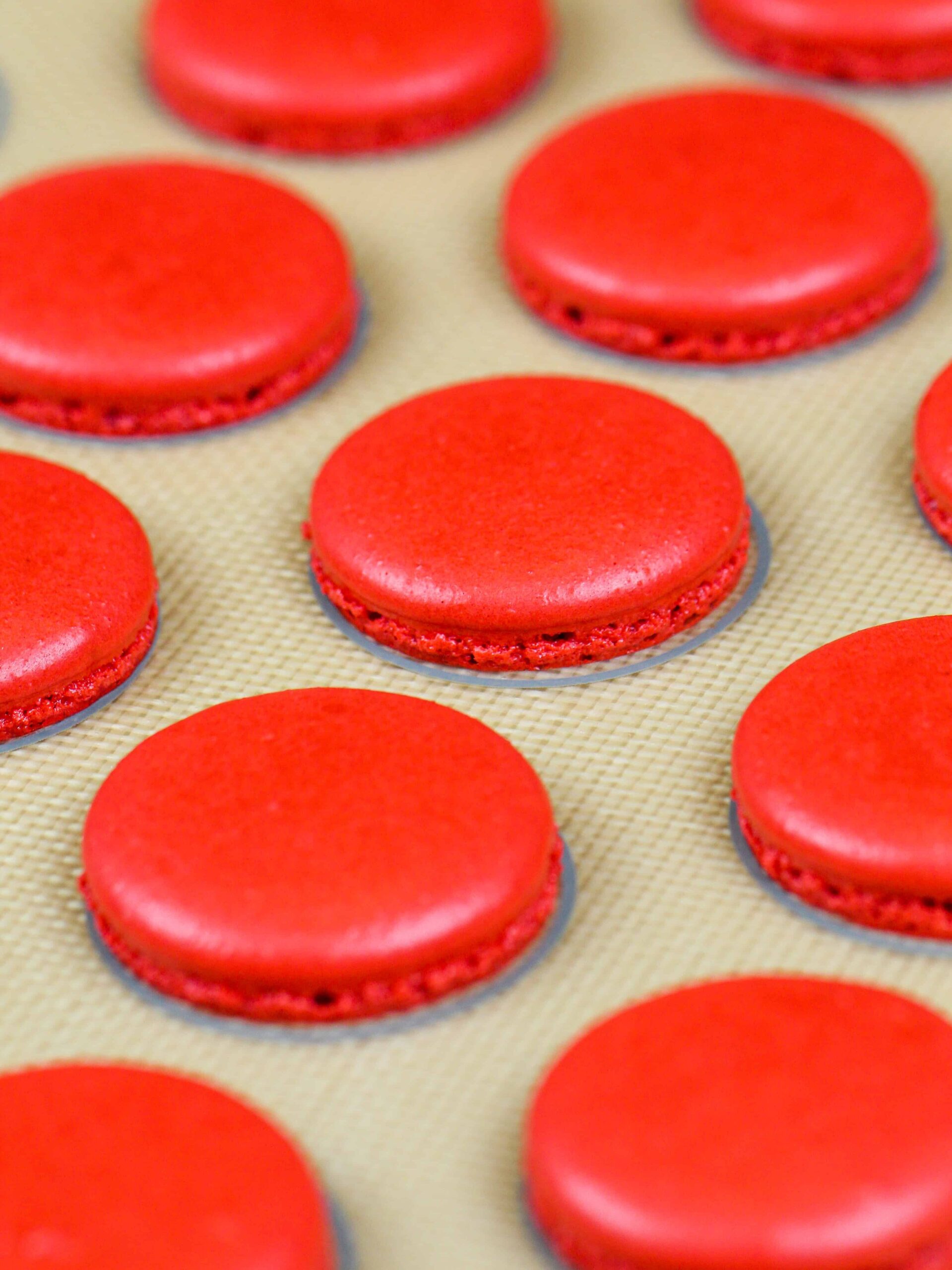 image of baked red velvet macaron shells