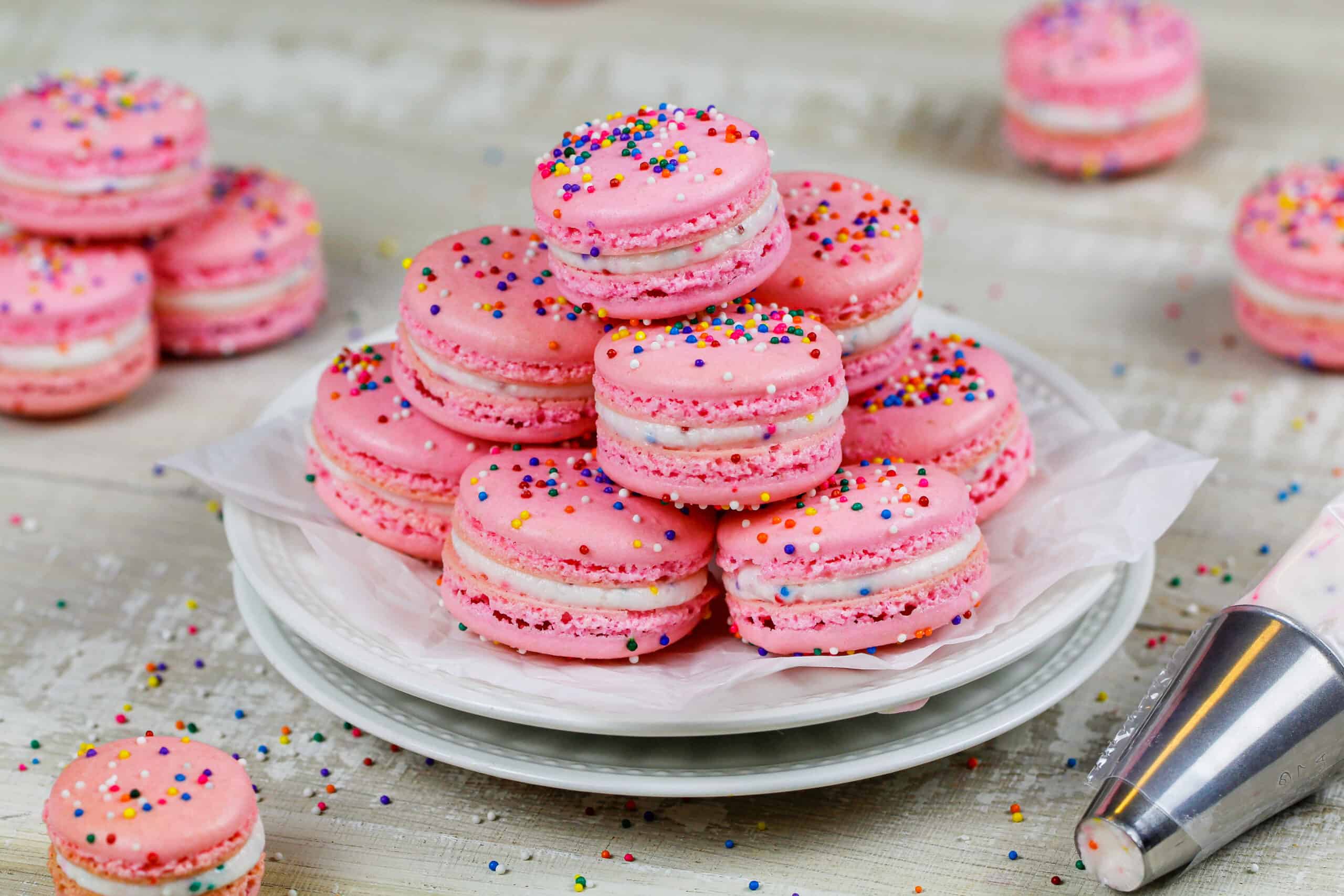 image of birthday cake macarons stacked on a plate