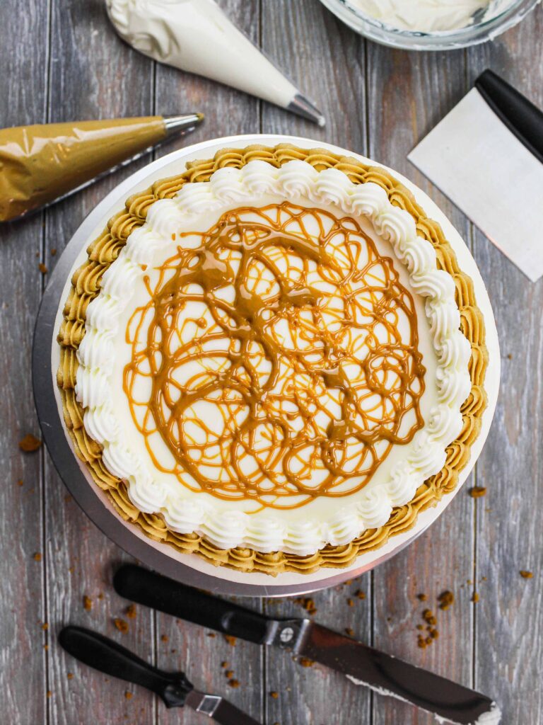 image of a biscoff layer cake that's been decorated with drizzled cookie butter