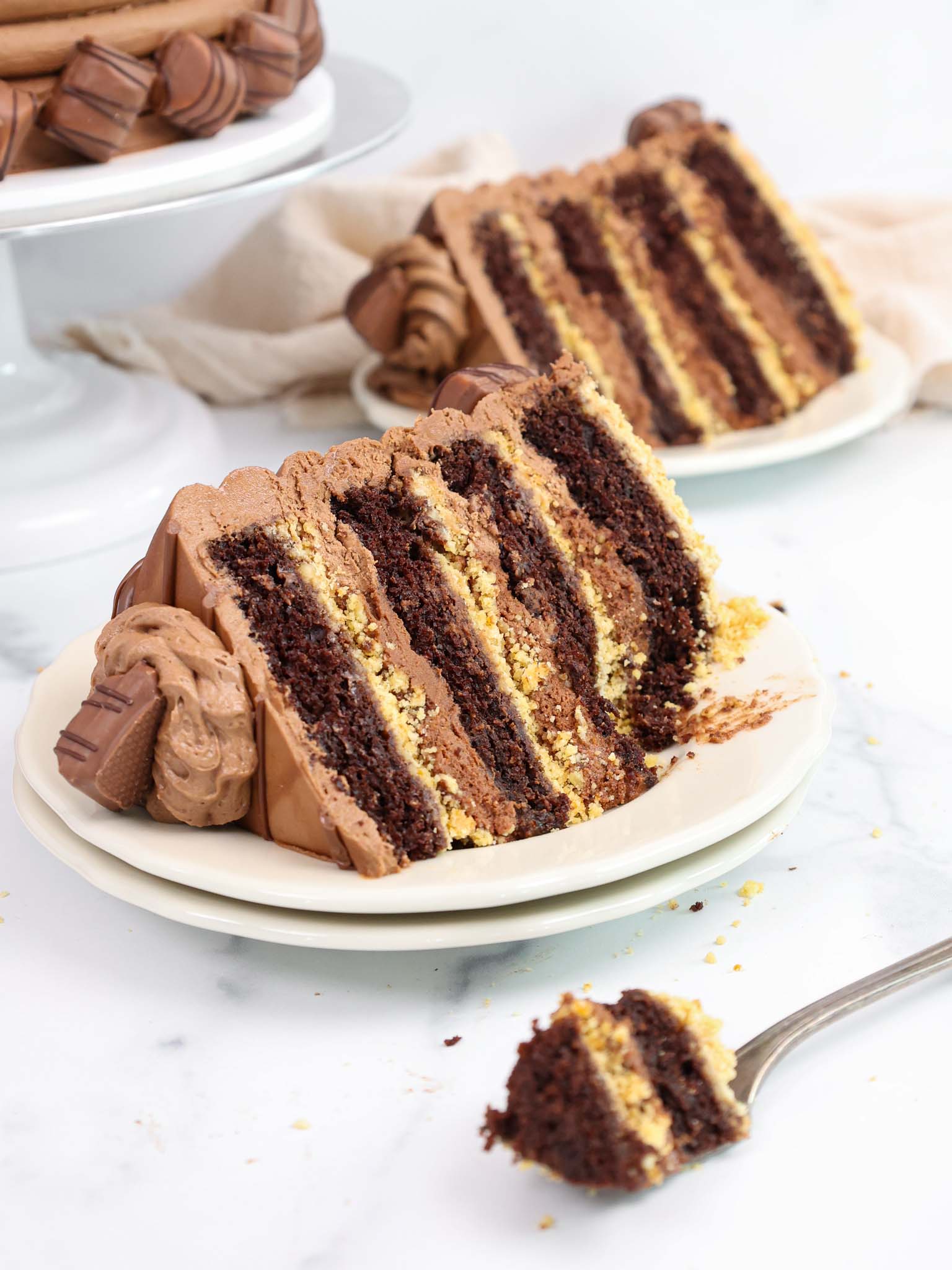 image of a slice of kinder bueno cake that's been cut into to show how moist and delicious it is