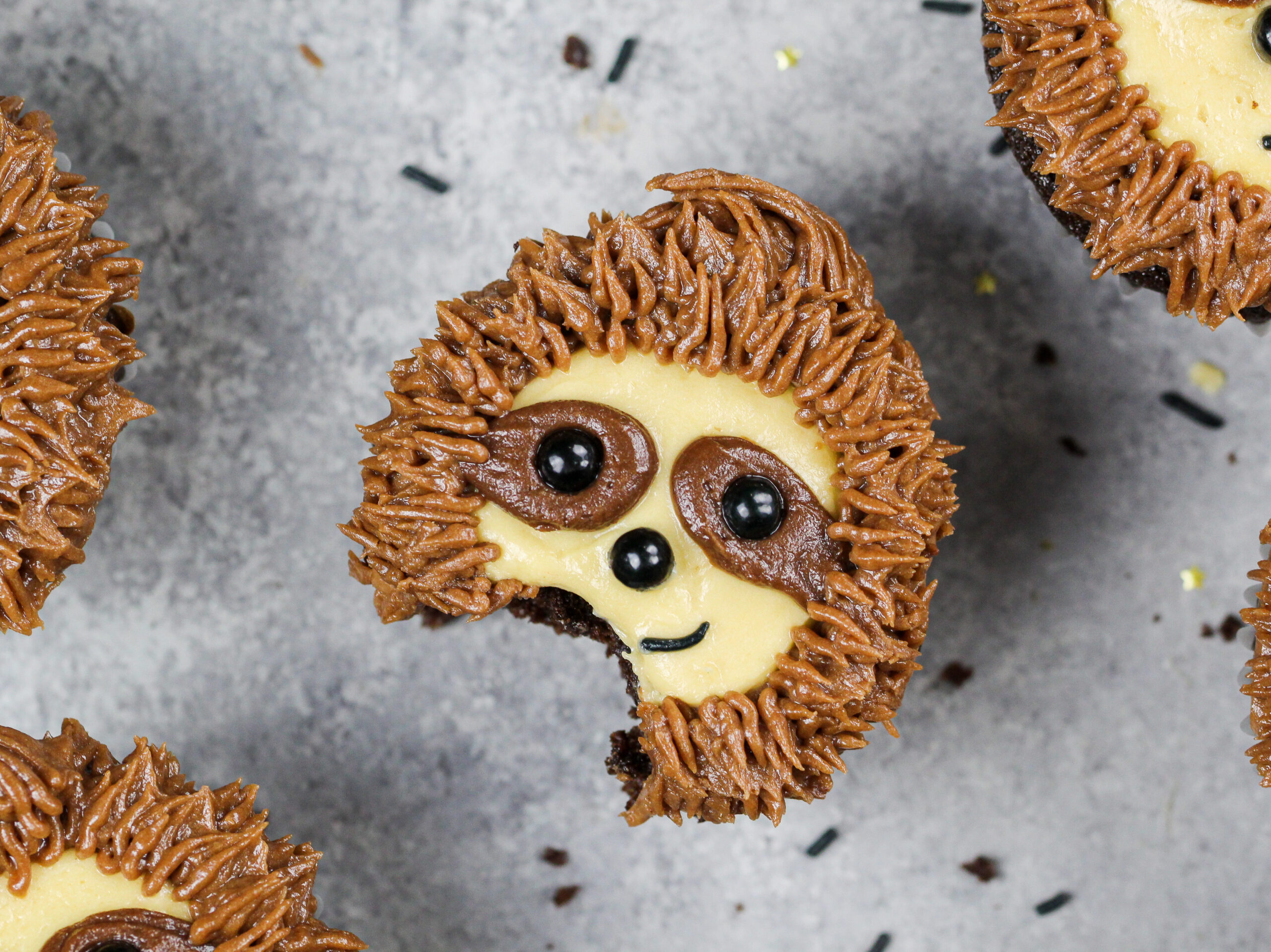 image of a sloth cupcake that's been bitten into