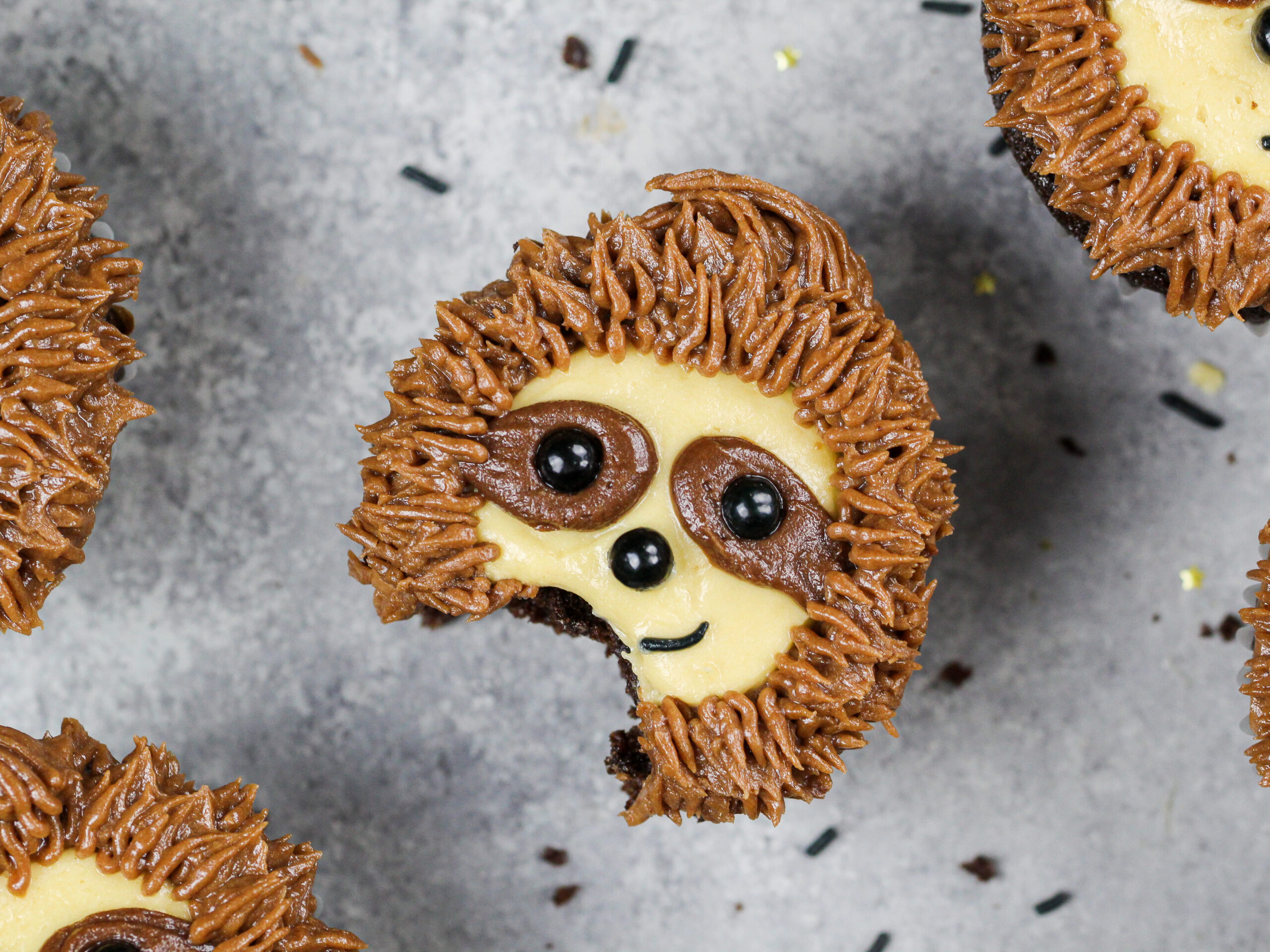 image of a sloth cupcake that's been bitten into