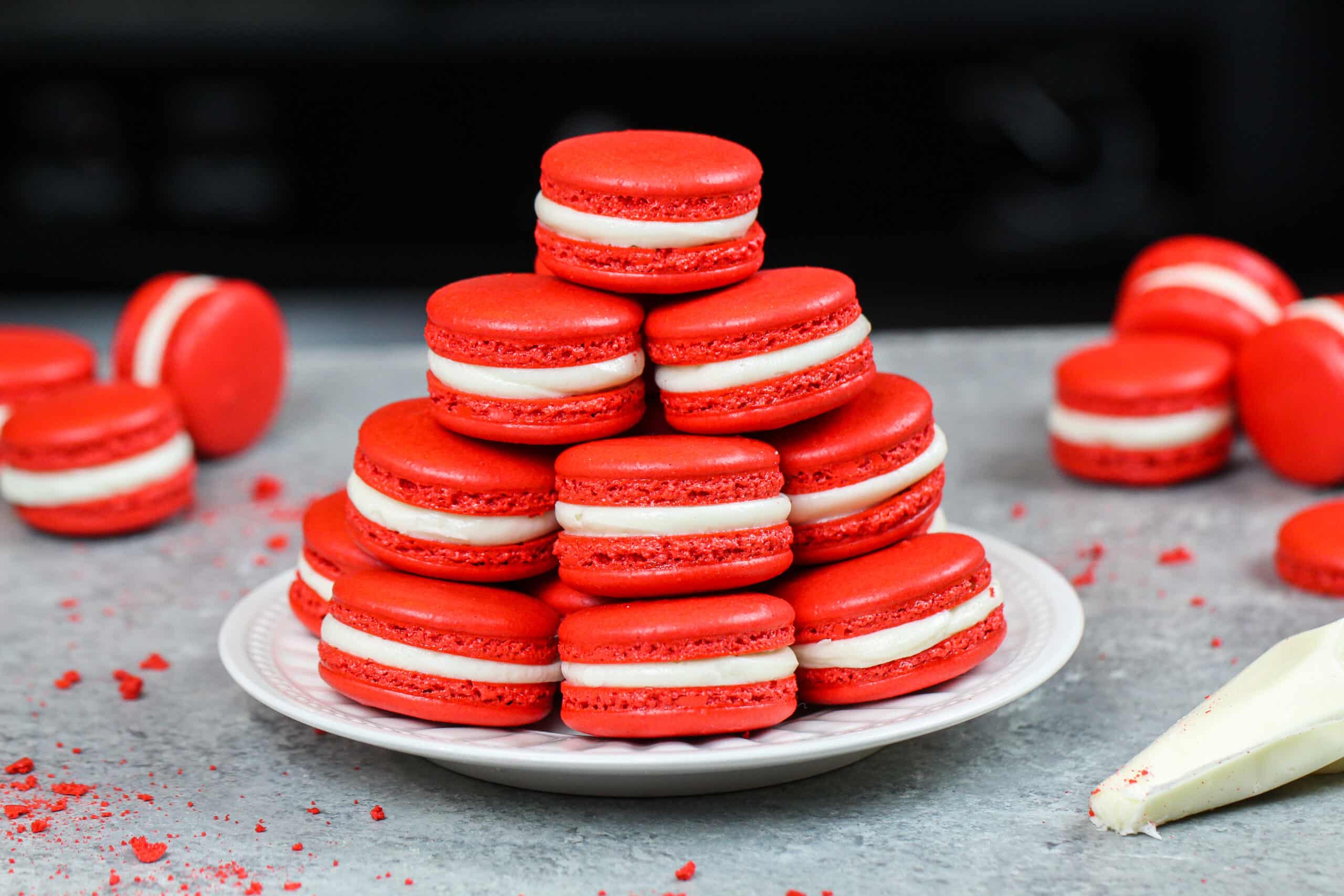 image of red velvet macarons stacked on a plate