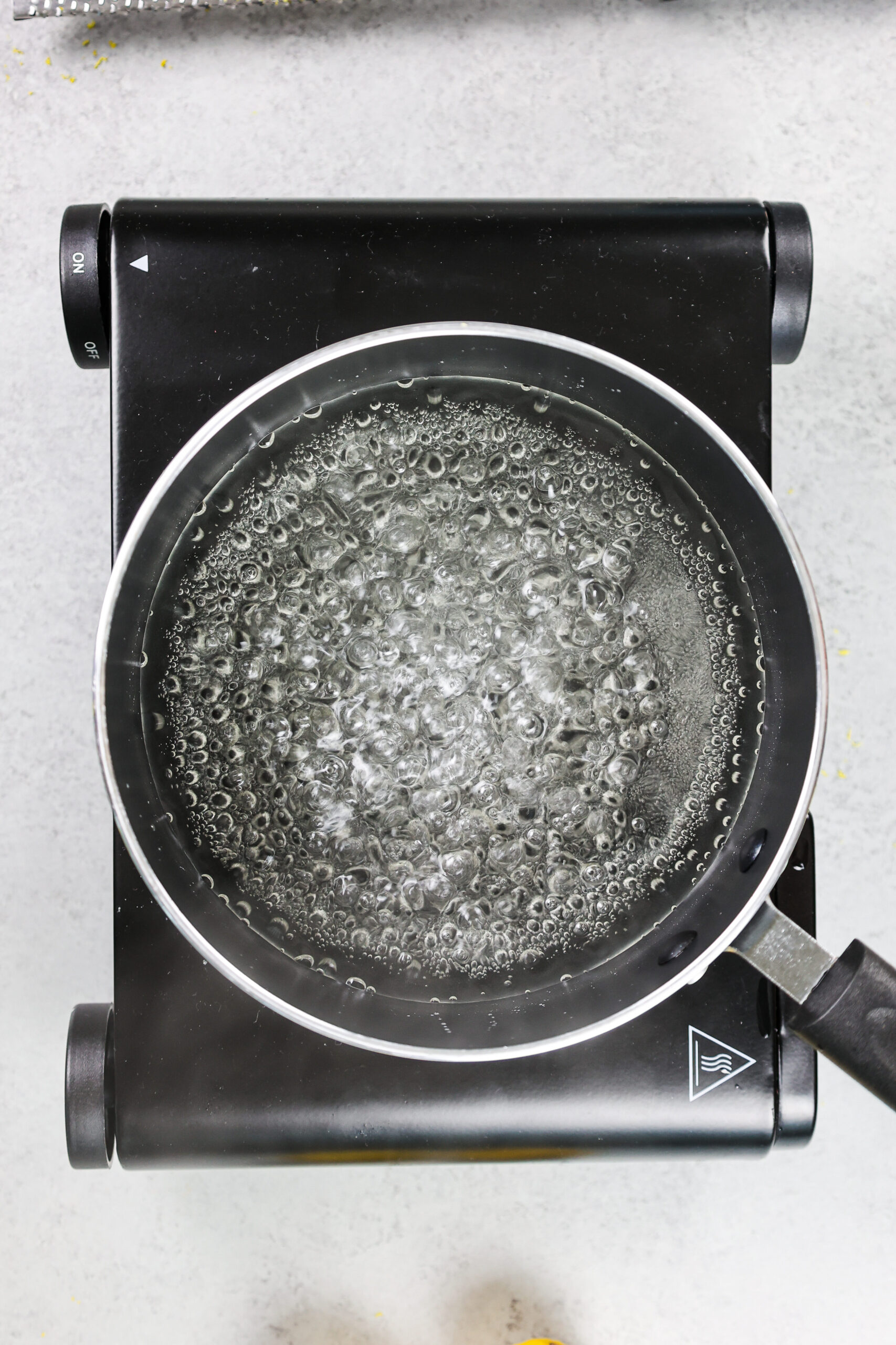 image of simple syrup being brought to a boil to dissolve the sugar