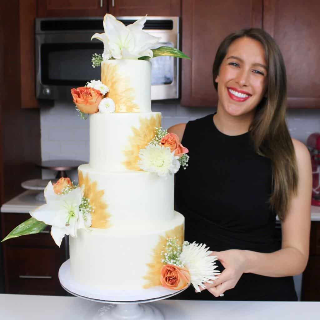 Photo of four tiered Tropical Inspired floral wedding cake