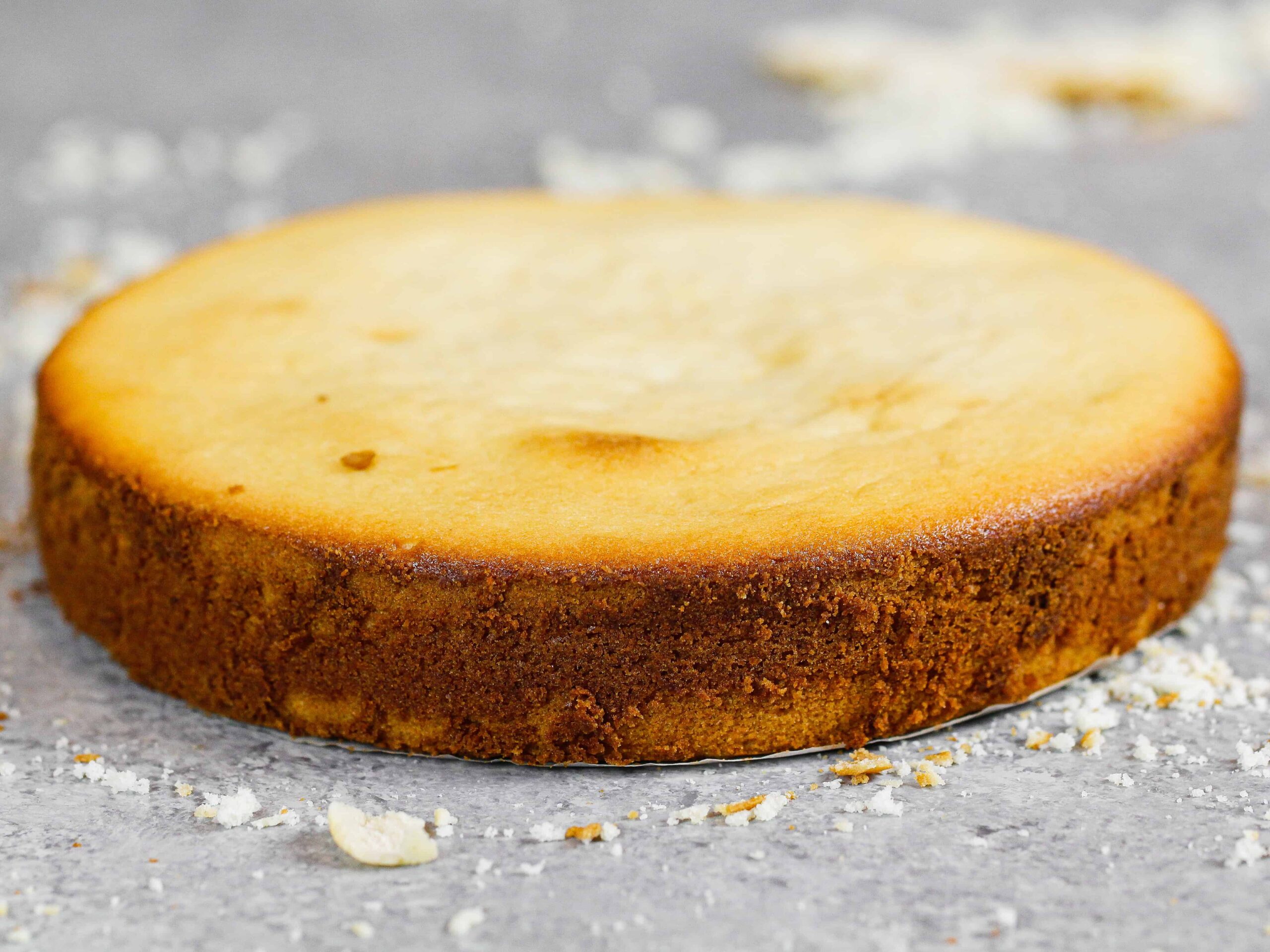 photo of a cake layer was baked in an oven that ran hot, and was placed too close to the sides of the oven which made the edges of the cake layer over-brown.