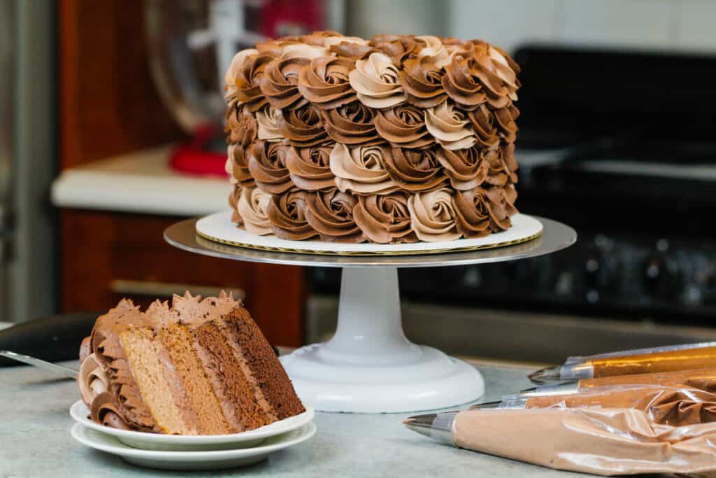 image of ombre chocolate cake decorated with buttercream rosettes