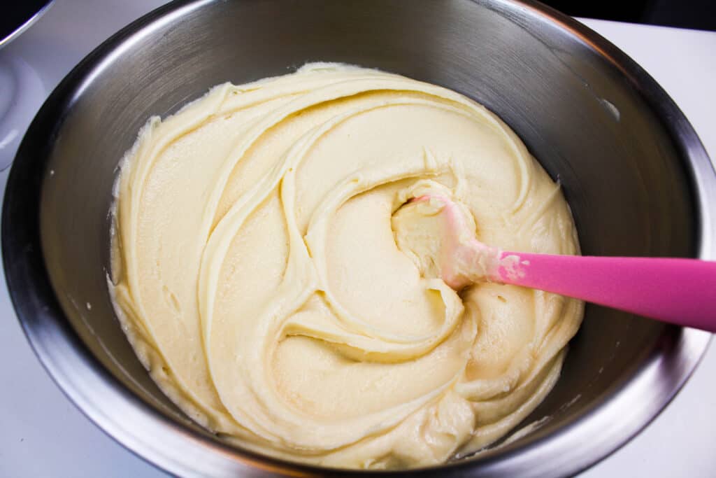 image of a batch of super smooth air bubble free frosting that has been stirred by hand