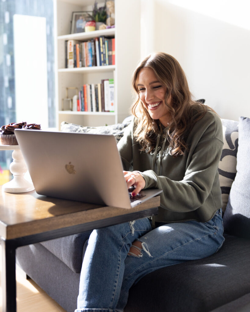 image of chelsey white of chelsweets working on her computer to edit a video for a partnership