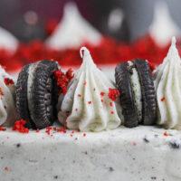 image of oreo cream cheese frosting piped on top of a cake