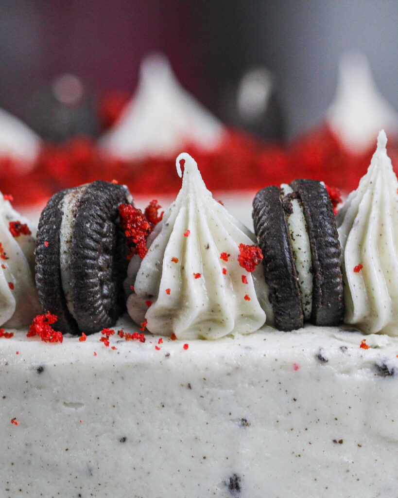 image of oreo cream cheese frosting piped on top of a cake