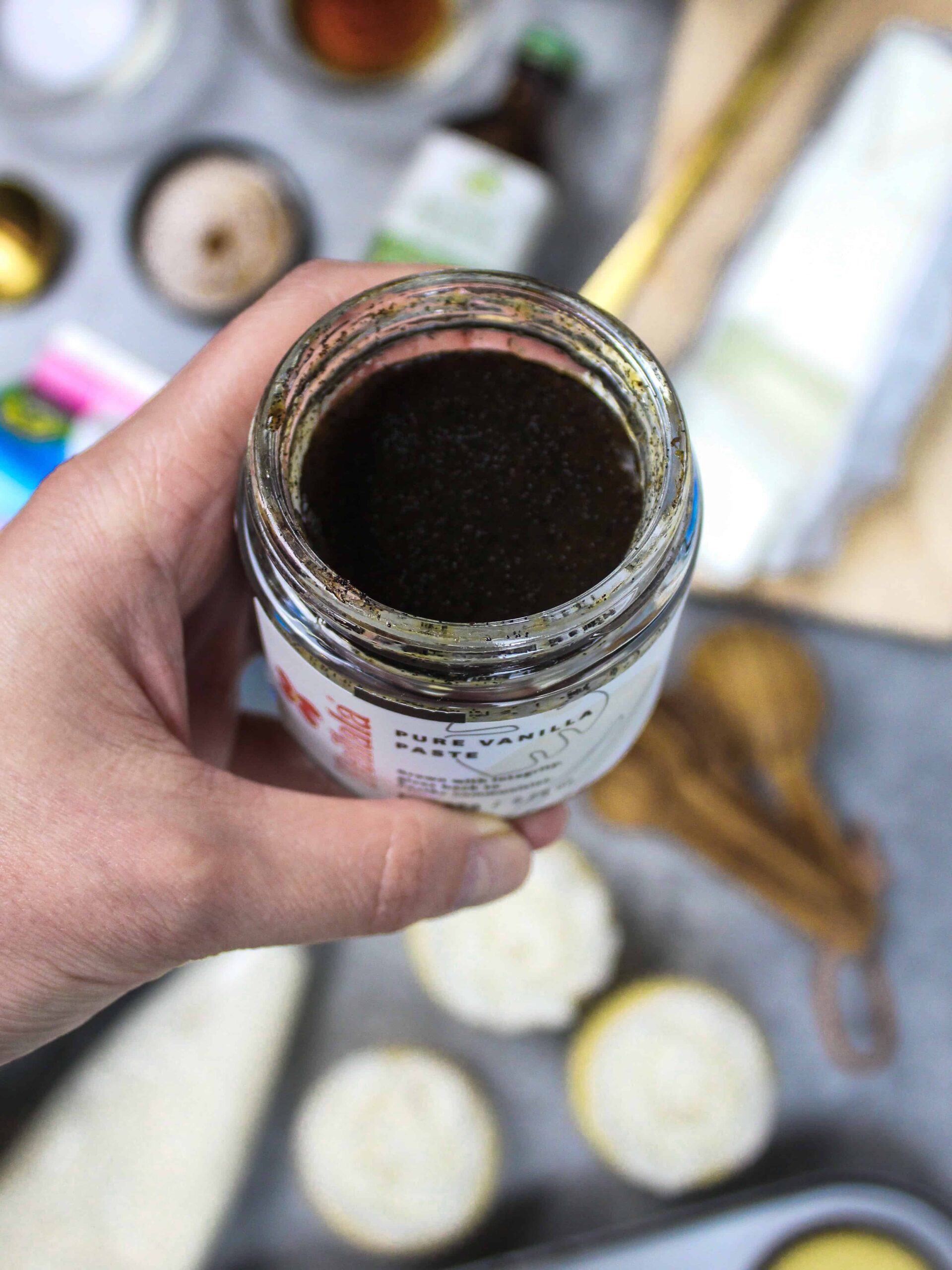 image of vanilla bean paste about to be used in vegan buttercream frosting recipe