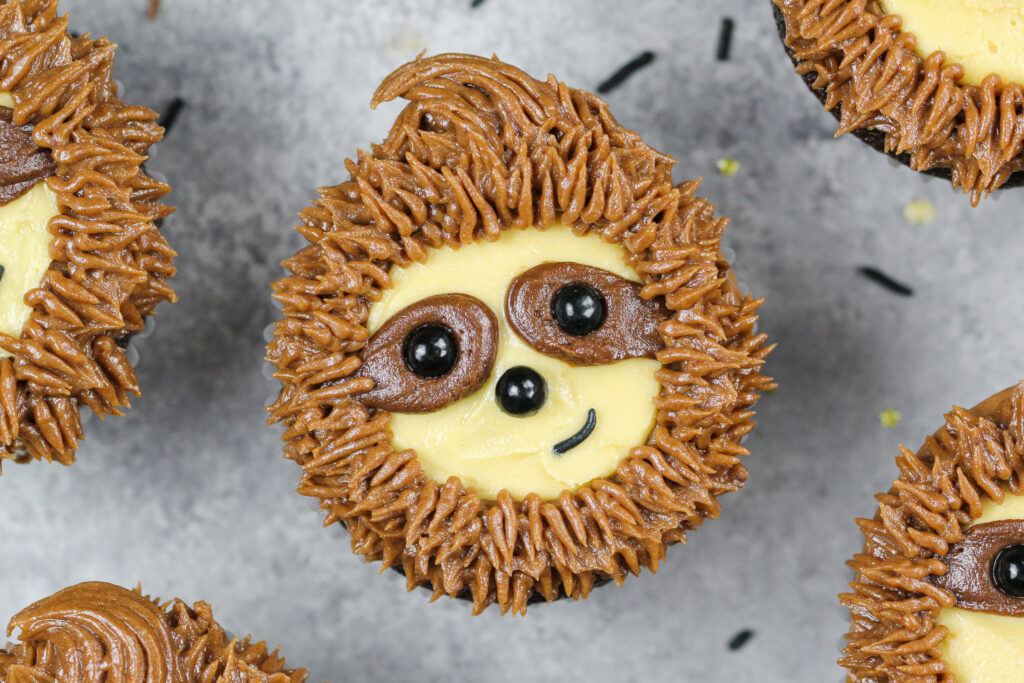 image of adorable sloth cupcakes made with chocolate cupcakes and chocolate peanut butter frosting