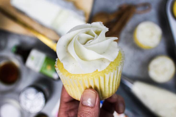 image of vegan buttercream frosting piped onto a cupcake