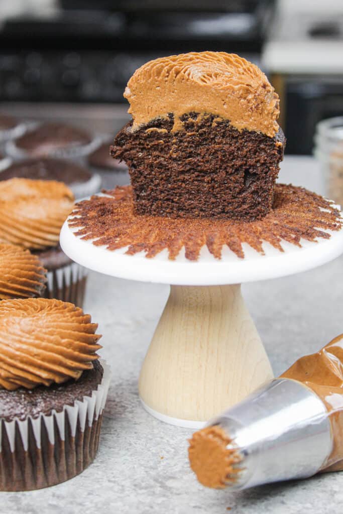 image of gluten free chocolate cupcake cut in half to show great structure and delicate crumb