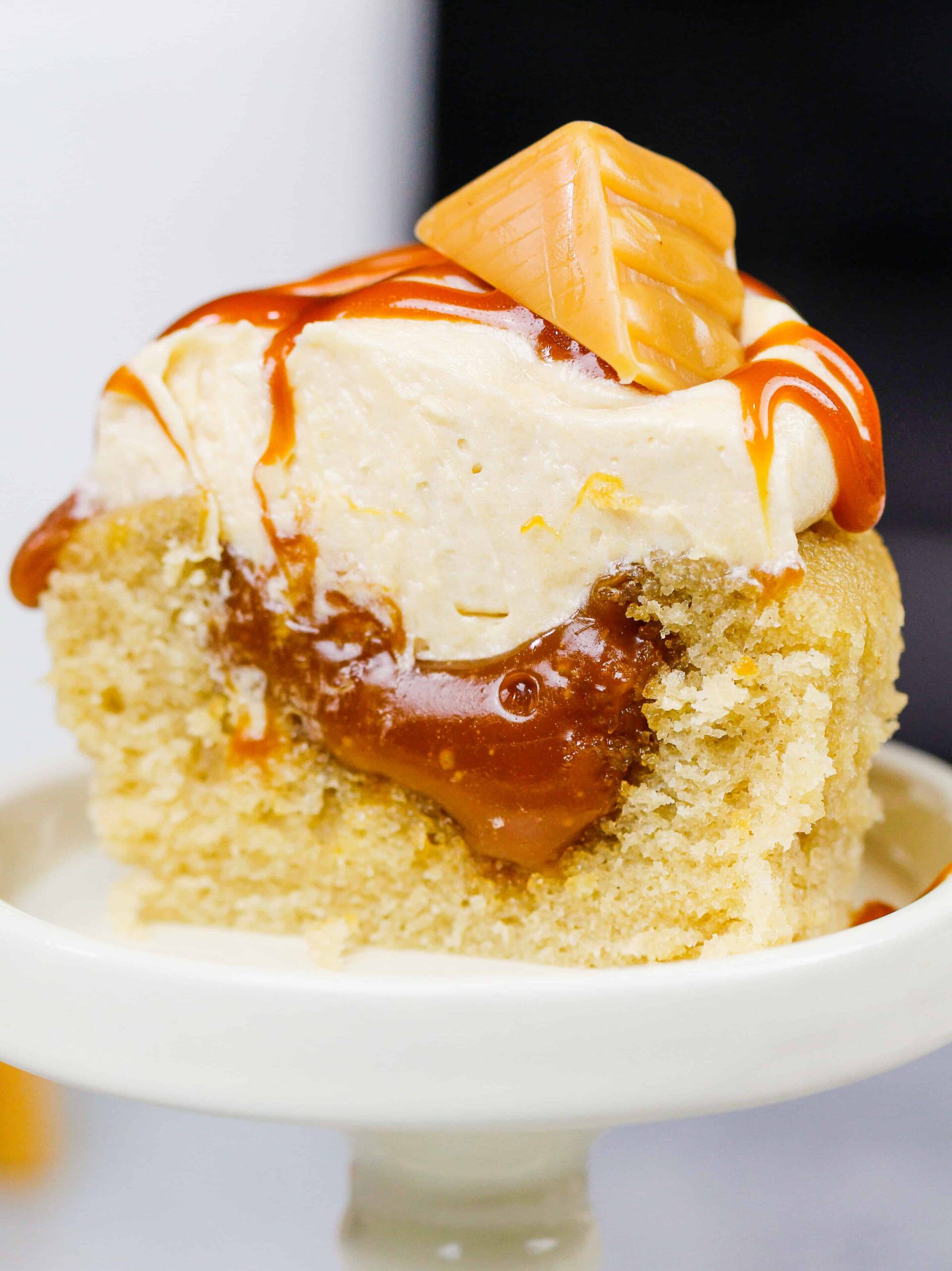 image of a caramel cupcake that's been cut in half to show it's gooey caramel filling