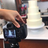 image of a cake video being made of a wedding cake