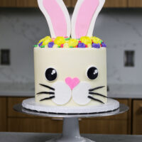 image of a bunny birthday cake made with funfetti cake layers and homemade vanilla buttercream