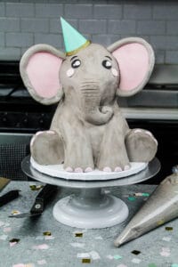 image of an elephant cake made mostly with buttercream and a little pink fondant