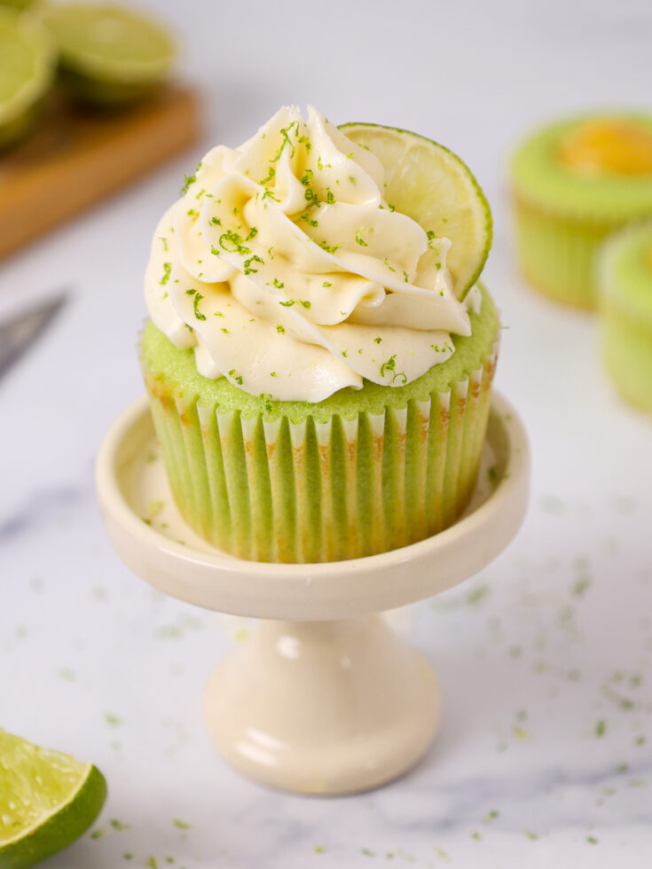 image of a lime cupcake that's been decorated with delicious lime buttercream and filled with homemade lime curd