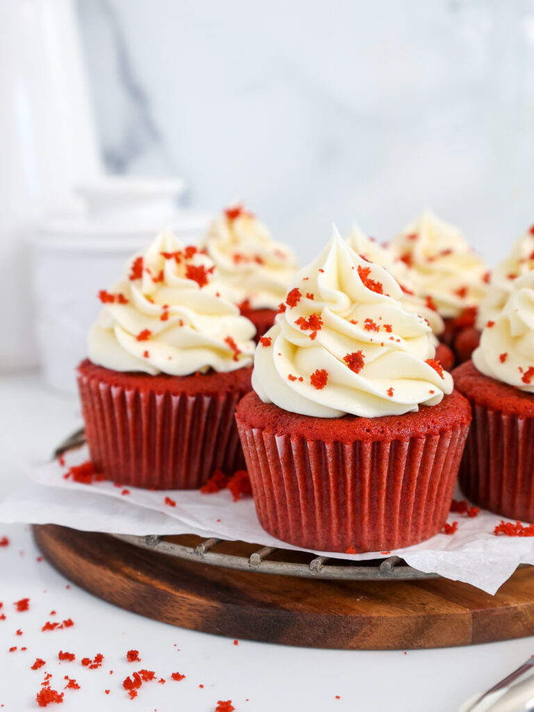 image of a red velvet cupcake recipe that's made with buttermilk and topped with cream cheese frosting