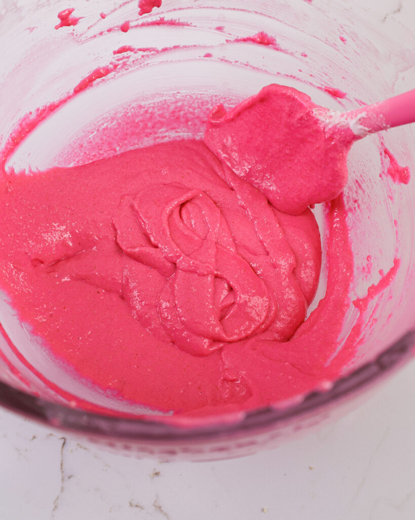 image of pink macaron batter that's been mixed perfectly and passed the figure 8 test