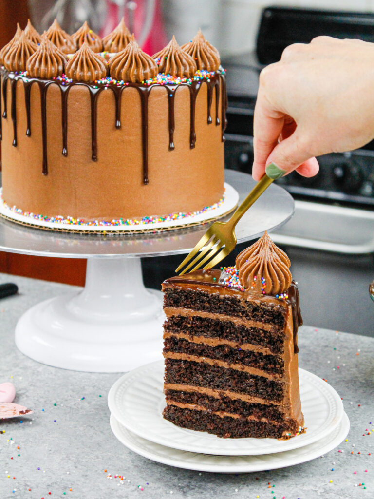 image of a chocolate drip cake made with moist chocolate cake layers and chocolate buttercream