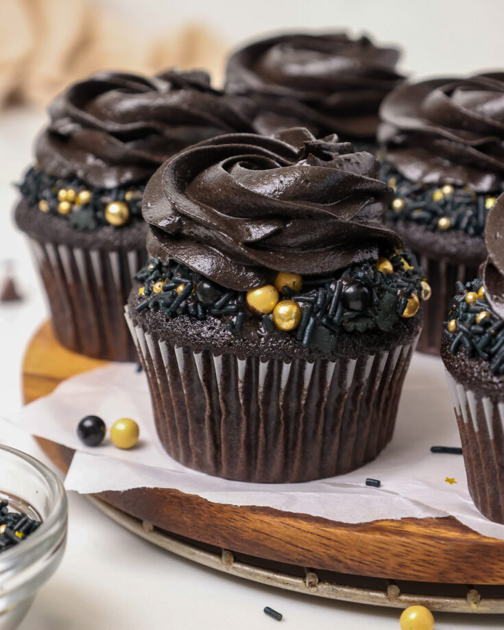 image of a black velvet cupcake that' been frosted with black cocoa buttercream