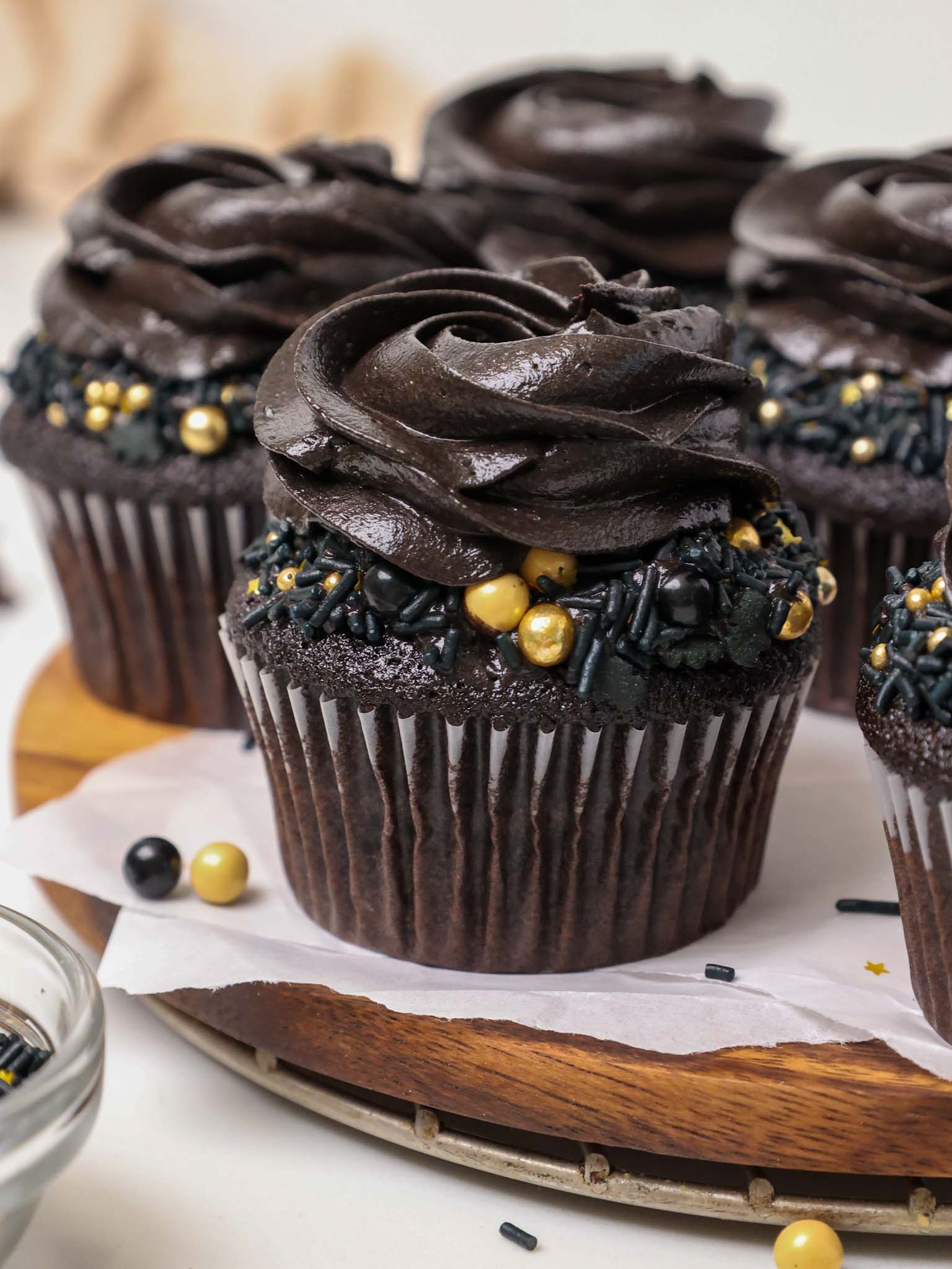 image of a black velvet cupcake that' been frosted with black cocoa buttercream