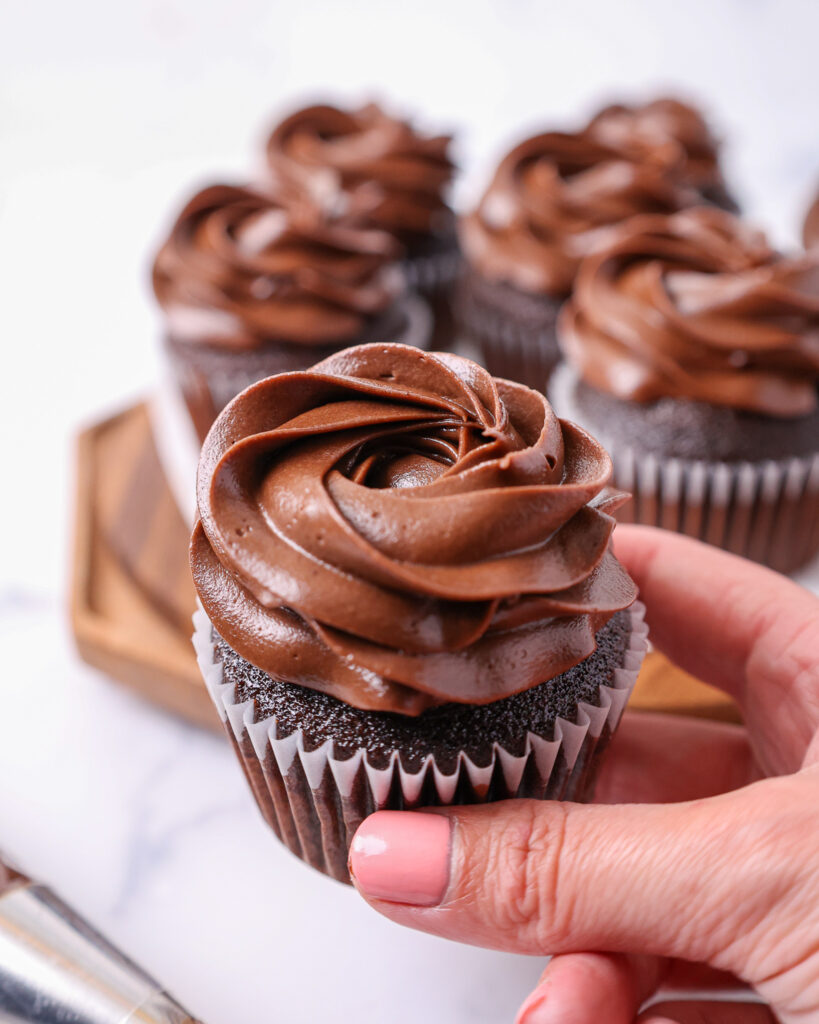 image of moist chocolate cupcakes that have been frosted with a decadent dark chocolate buttercream