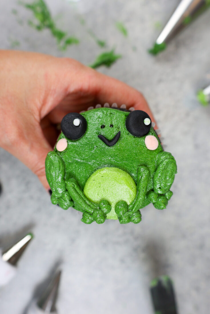 image of an adorable buttercream frog cupcake
