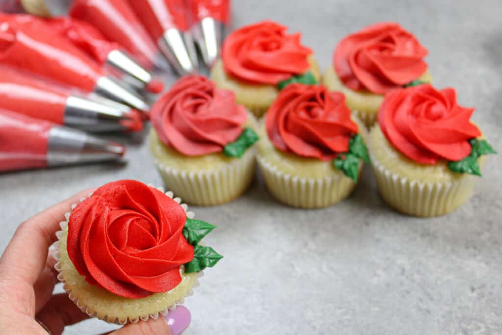 image of cupcake decorated with a bright red buttercream rosette