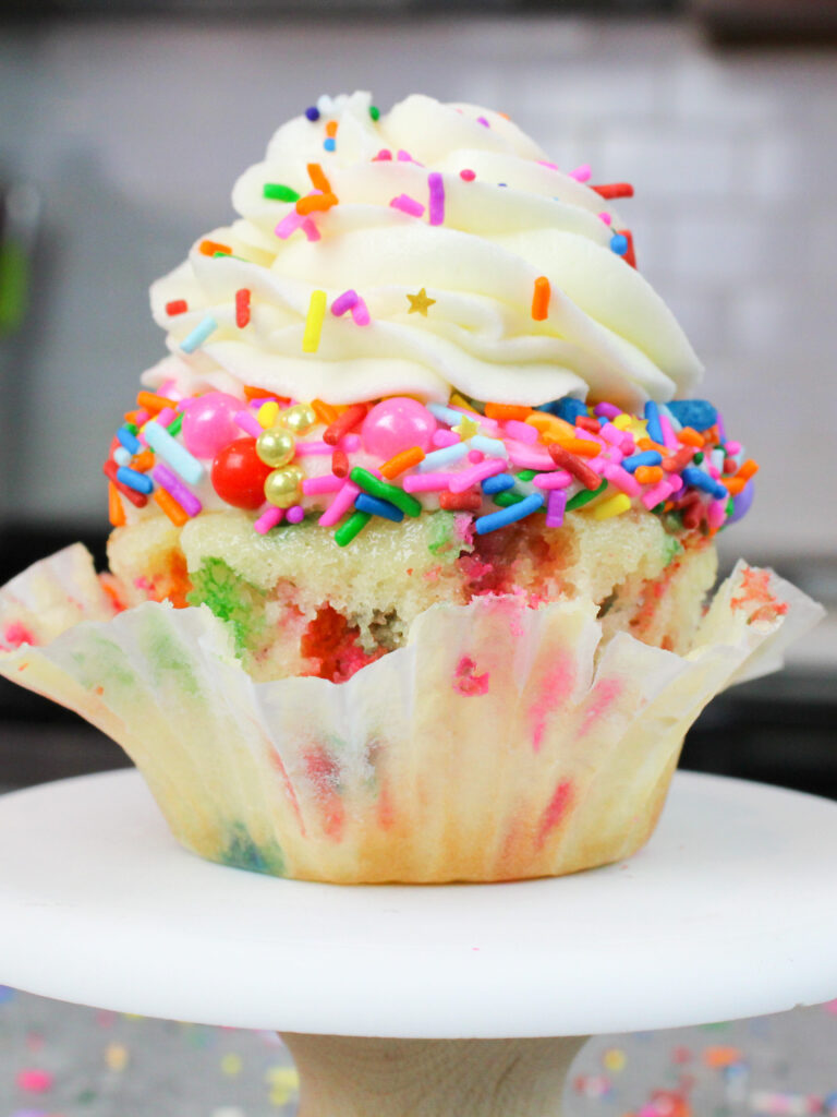 image of a cute funfetti sprinkle cupcake that's been unwrapped
