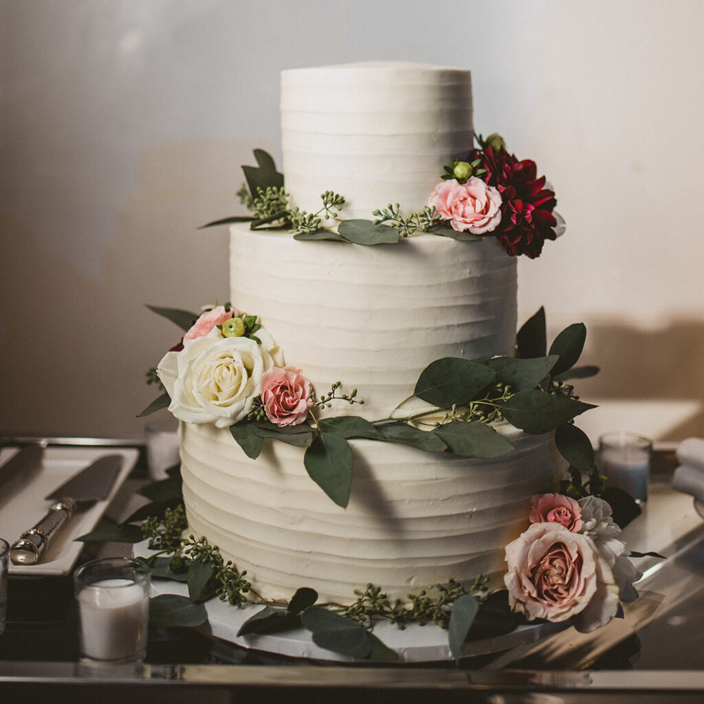 image of a wedding cake sized out using a cake portion guide to determine how many servings and what size of cake needed to be made