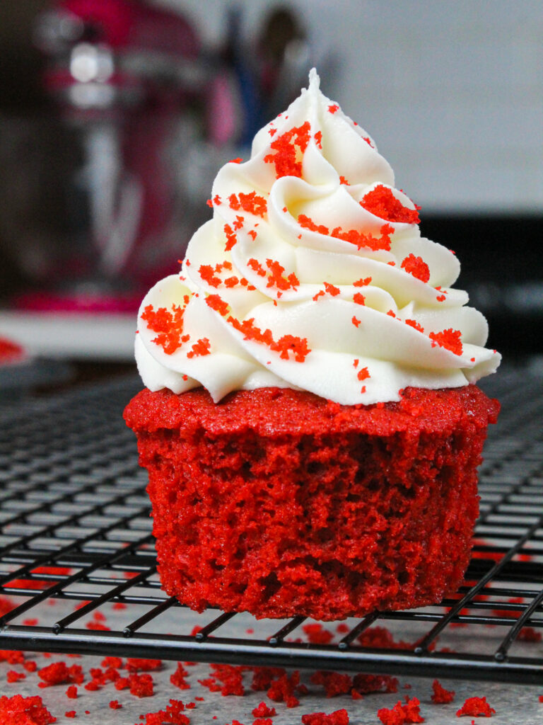 image of beautiful red velvet cupcake, decorated with red velvet crumbs