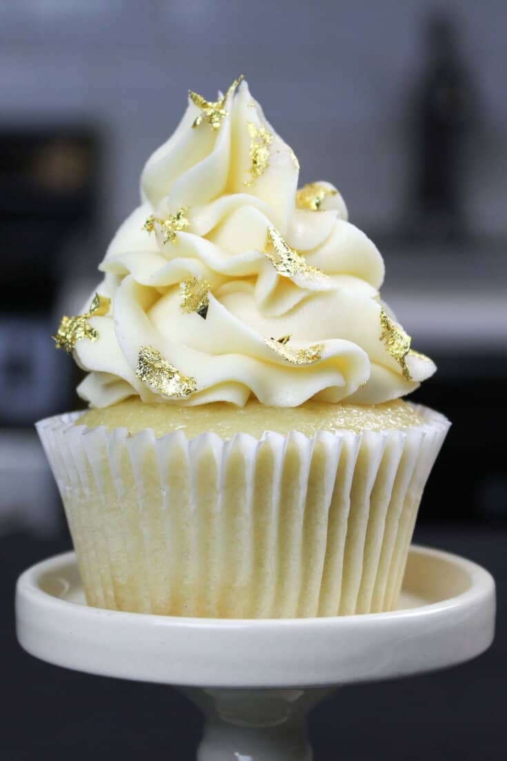 image of vanilla cupcake decorated with edible gold leaf