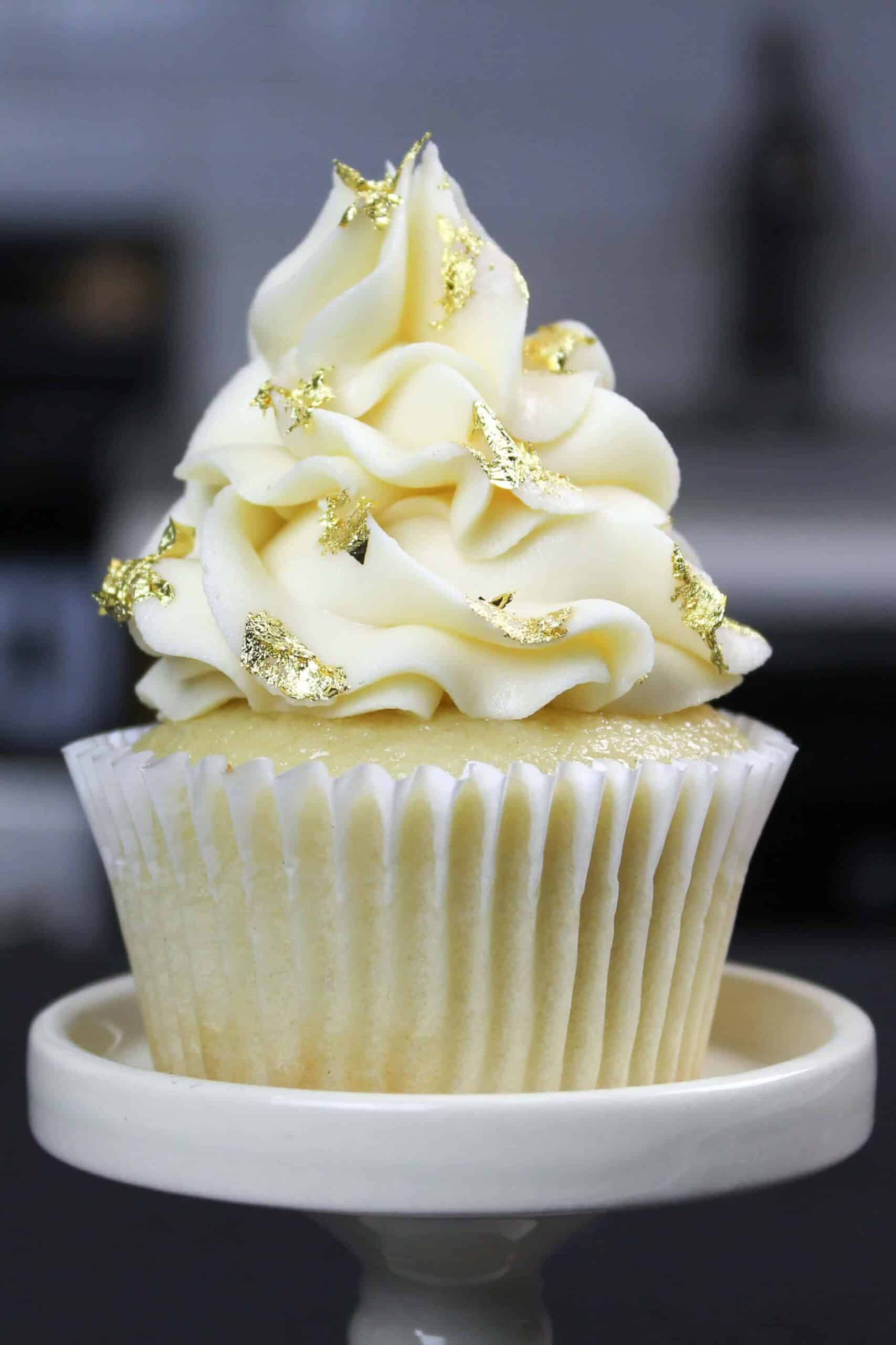 image of vanilla cupcake decorated with edible gold leaf