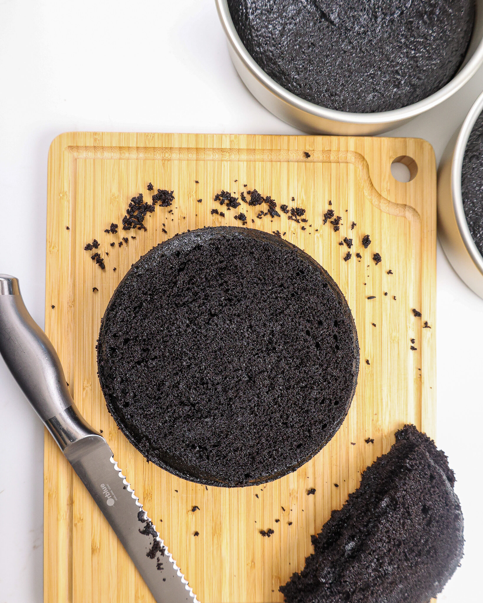 image of a black velvet cake layer that's been leveled with a serrated knife