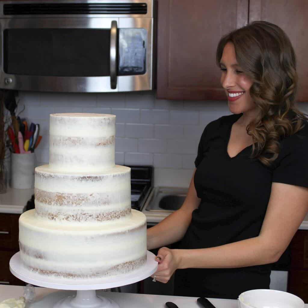 Photo of a three tiered semi naked wedding cake