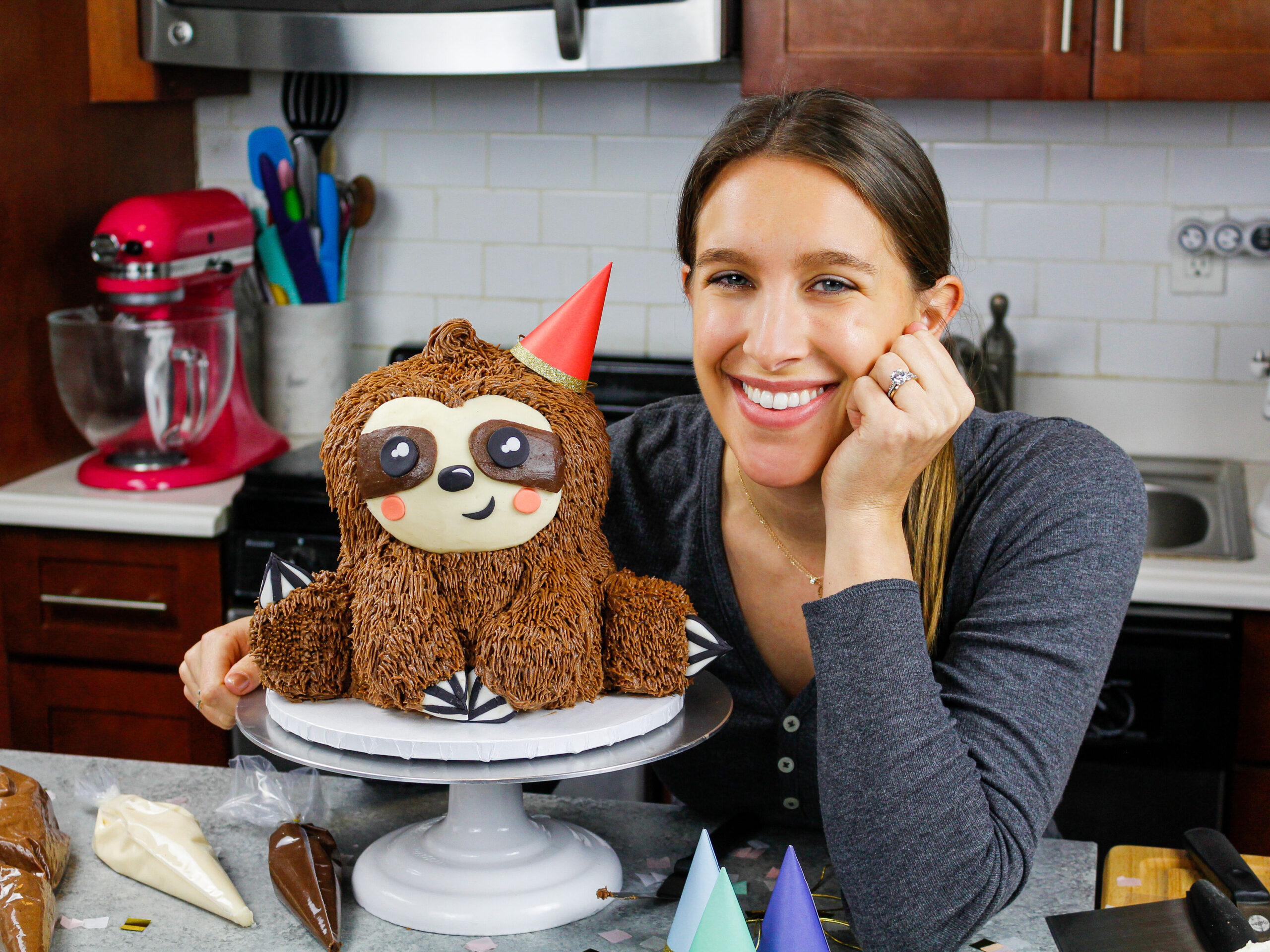 image of chelsey white with a sloth cake that she made to share on her blog chelsweets