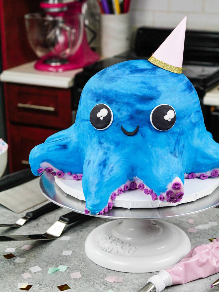 image of an octopus cake made with colorful cake layers, buttercream and cake decorating rice krispie