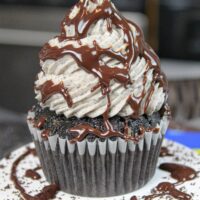 image of oreo cupcake drizzled with chocolate ganache