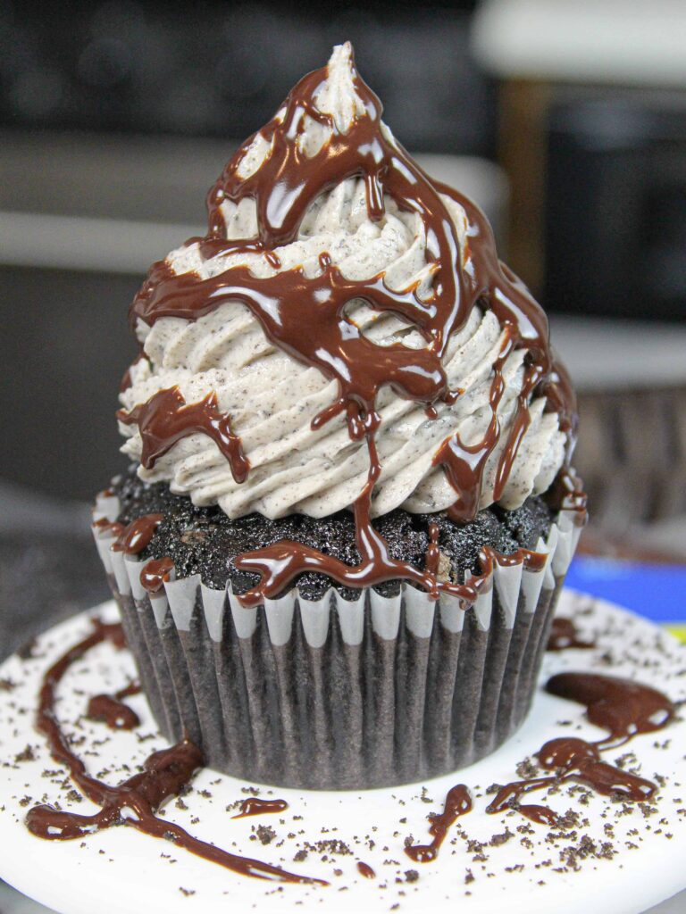 image of oreo cupcake drizzled with chocolate ganache