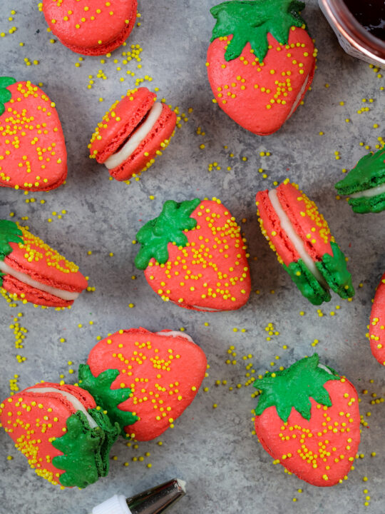 image of adorable french strawberry macarons filled with buttercream and strawberry jam