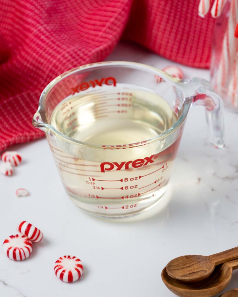 image of peppermint simple syrup in a pyrex container