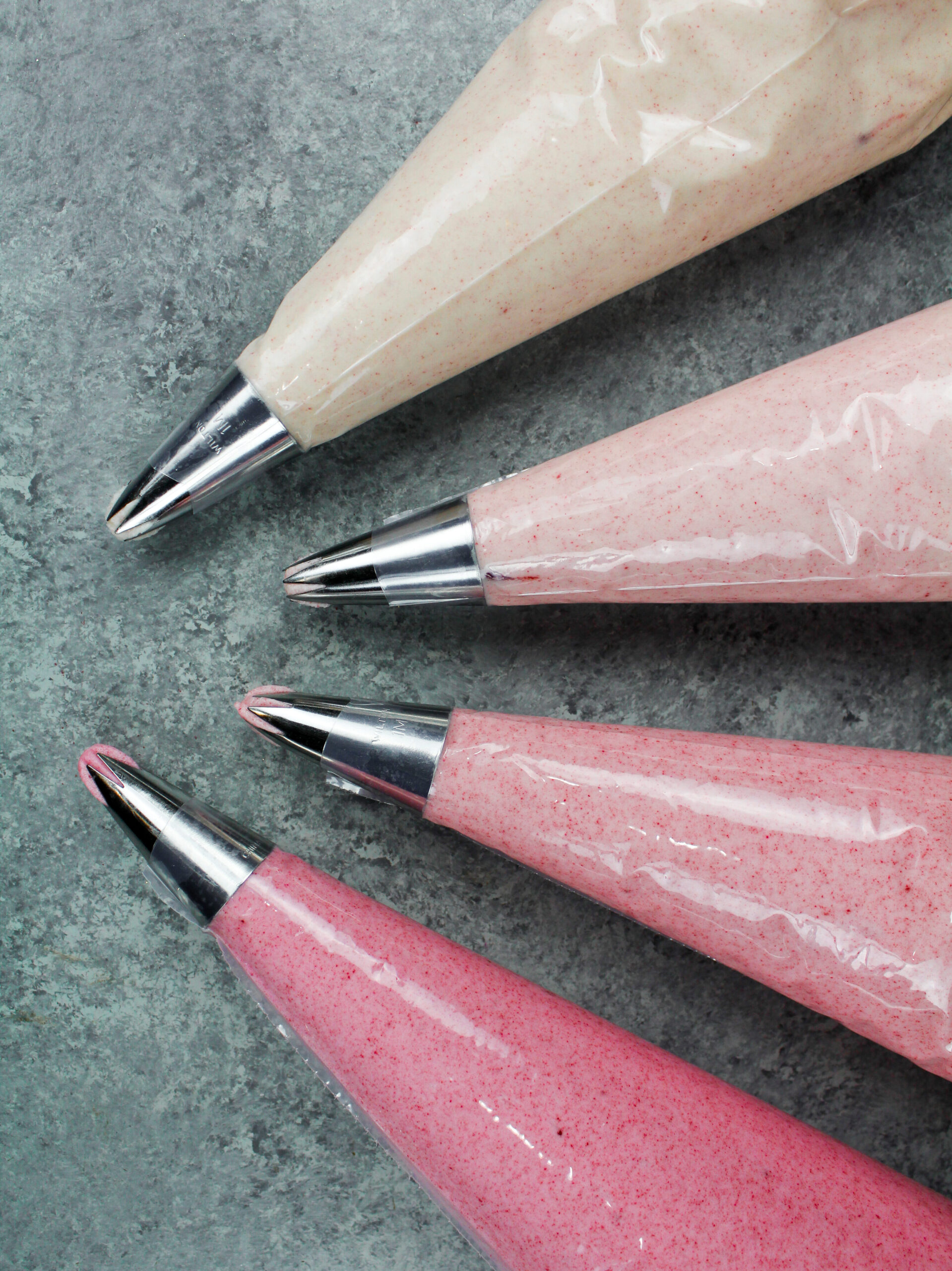 image of pink ombre buttercream that has been colored naturally with raspberry powder